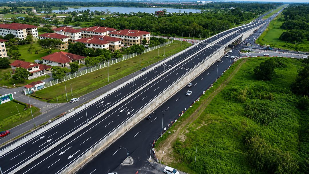 Aerial drone view of a highway winding through Sarawak terrain